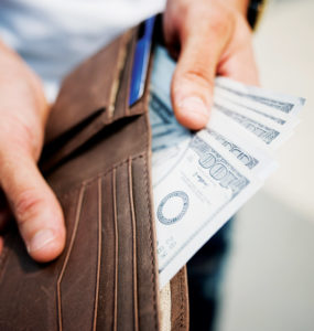 person holding cash and wallet, finance and banking expertise