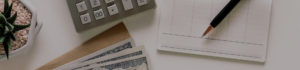 calculator and cash on a table, taxation law