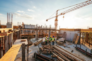 Investors and contractors on construction site, Taking Advantage of Opportunity Zone Tax Incentives