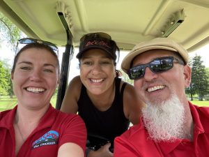 Happy golfers in a golf cart