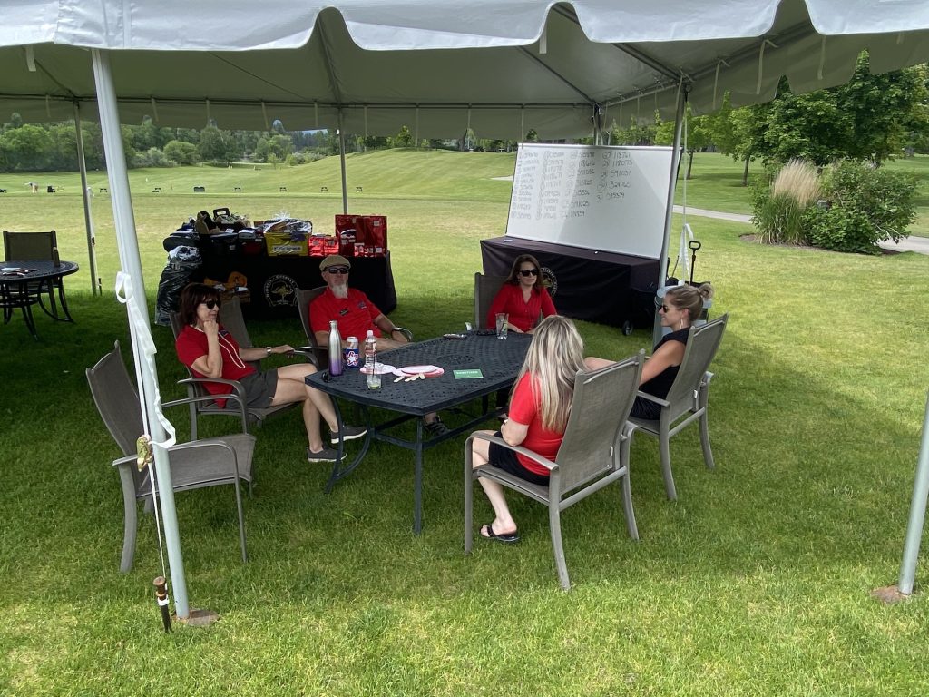 Fellow Red Coats guarding the raffle prizes while staying cool in the shade - Worden Thane Sponsors Red Ripper Golf Tournament