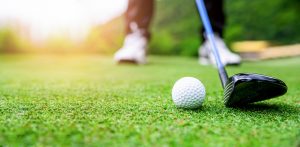 Close up golf ball on green grass, Worden Thane Sponsors Red Ripper Golf Tournament