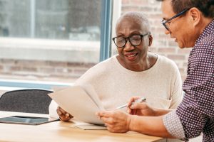 Mature woman working with her lawyer on estate planning