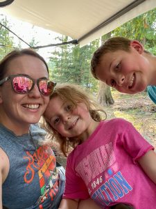 Worden Thane employees and their children camping