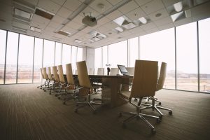 Dramatic shot of an modern business conference room. Complying with the Corporate Transparency Act (CTA).