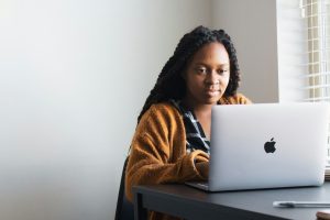 Independent contractor working from home on a laptop.