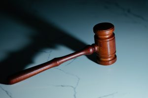 Wooden gavel on marble, concept of the court ruling on the the Corporate Transparency Act.
